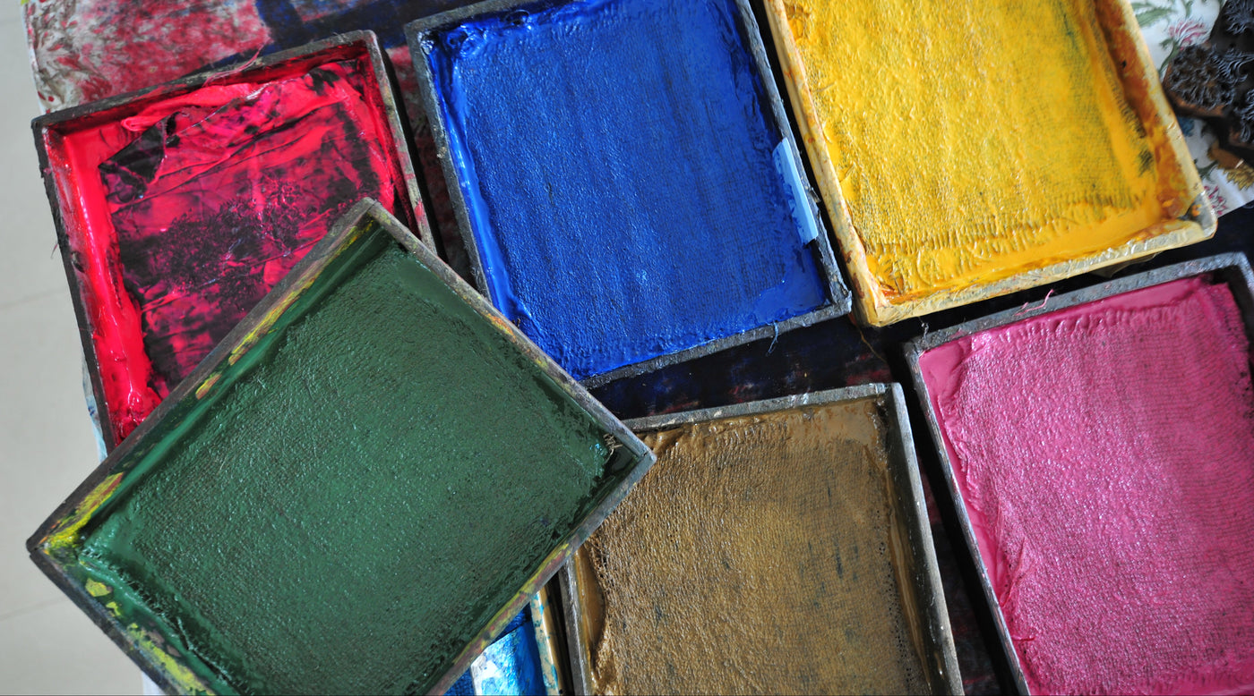 Color swatches in various colors on a textured surface
